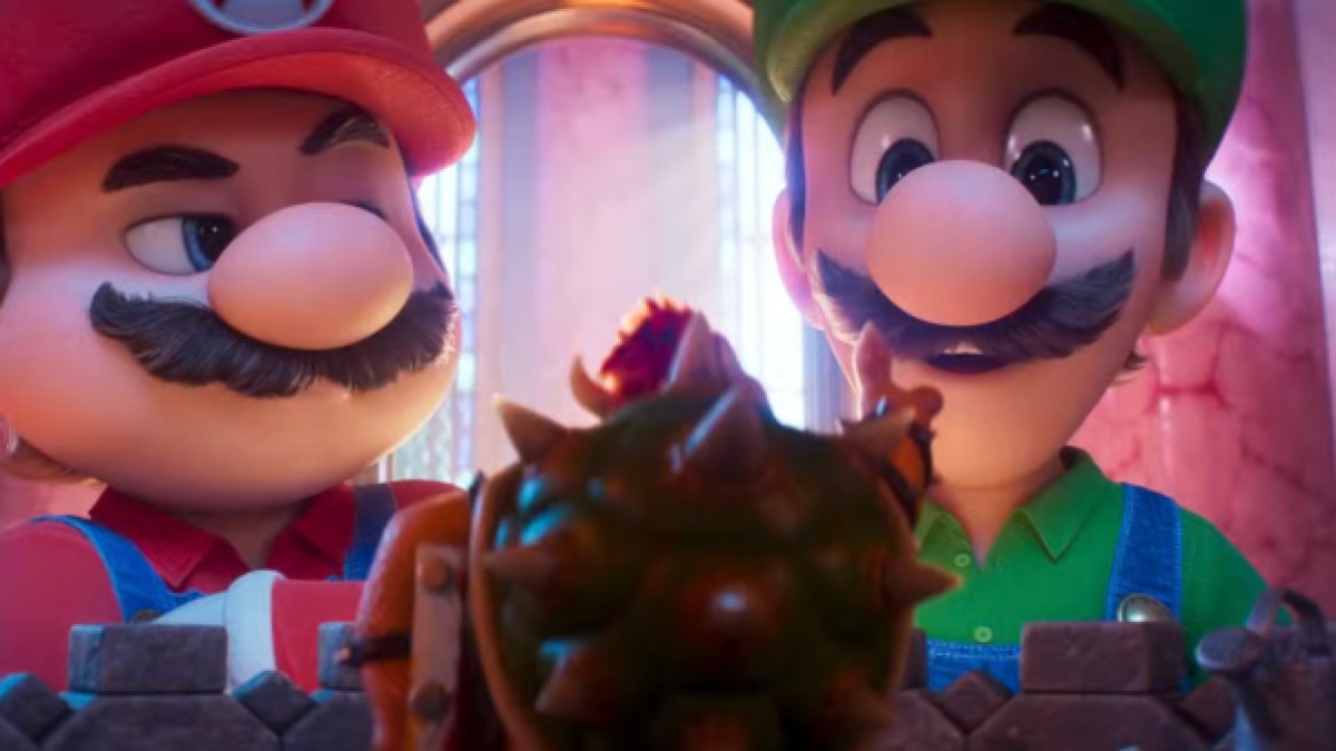 Mario flutuando no espaço cercado por estrelas e planetas coloridos, em cena do novo filme Super Mario Galaxy.