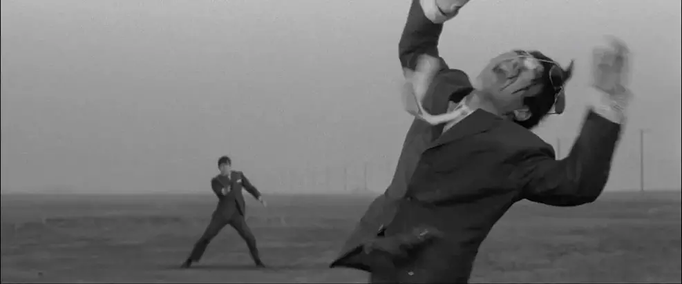 Cena de ação estilizada do filme A Colt is My Passport dirigido por Gareth Evans.