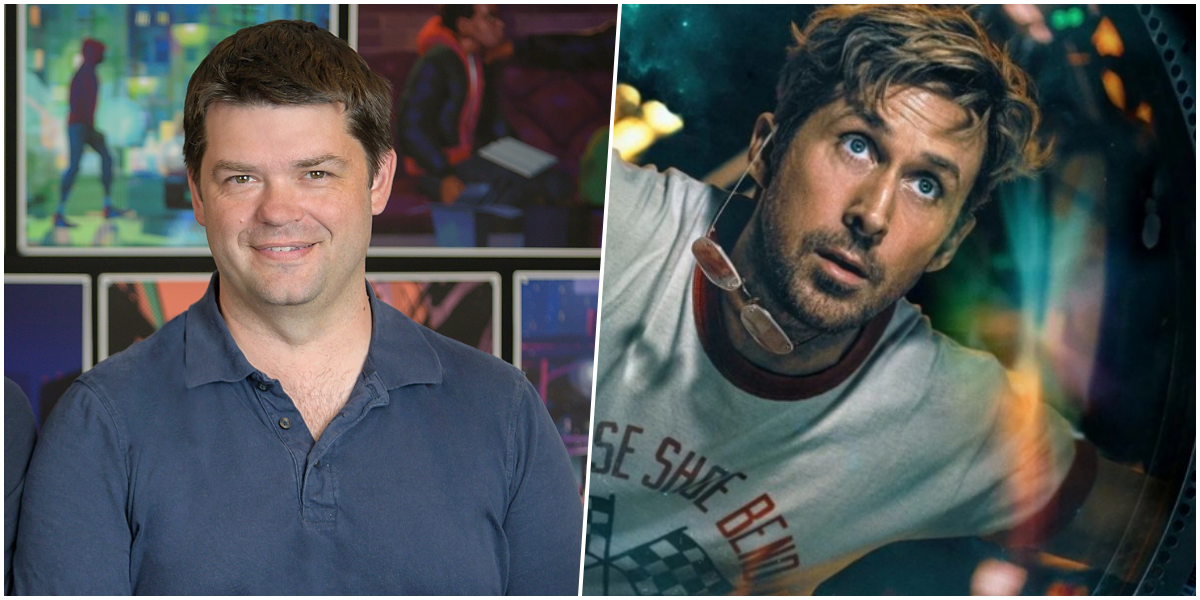 Fotografia em plano médio de Christopher Miller, homem branco de cabelo castanho curto, sorrindo e falando em um microfone em pé em um evento de lançamento de "Devoradores de Estrelas". Ele veste um blazer azul-marinho e uma camisa cinza. O fundo está desfocado, mostrando pessoas e luzes do evento.