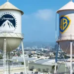 Foto da fachada da Warner Bros com logotipo da Paramount ao lado, destacando a aquisição estratégica do estúdio