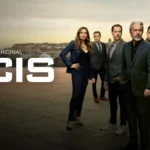 O ator LL Cool J como o agente Sam Hanna em cena de ação da franquia NCIS.