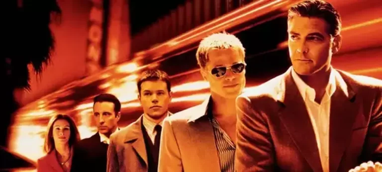 Os atores Bradley Cooper e Margot Robbie, que protagonizarão a nova história da franquia Onze Homens e um Segredo.