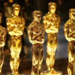 Estatueta dourada do Oscar em destaque representando o ciclo de premiações de 2027.