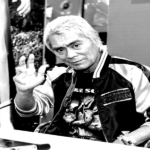 Foto institucional de Kenji Ohba divulgada pela Japan Action Enterprise em registro ligado ao universo do tokusatsu.
