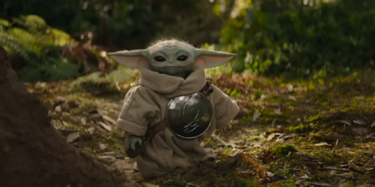 Din Djarin e Grogu em cena de Star Wars O Mandaloriano e Grogu com estética espacial da Lucasfilm