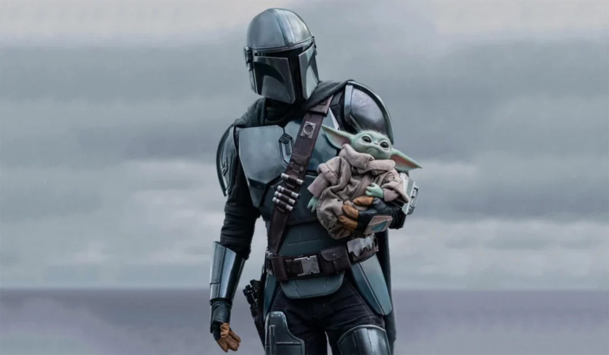 Din Djarin e Grogu em cena de O Mandaloriano e Grogu durante nova aventura da franquia Star Wars.