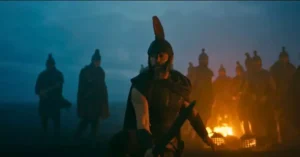 Christopher Nolan dirige cena prática de A Odisseia com dublês enterrados na areia.