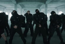 BTS em cena do clipe “Hooligan” com visual sombrio e estética da era ARIRANG