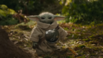 Din Djarin e Grogu em cena de Star Wars O Mandaloriano e Grogu com estética espacial da Lucasfilm